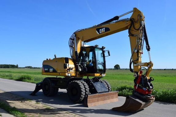 Аренда колесного экскаватора Caterpillar M315D2 с грейфером