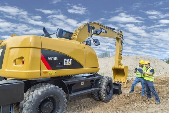 Аренда колесного экскаватора Caterpillar M317D2 с грейфером