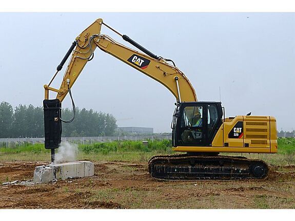 Гусеничный экскаватор с гидромолотом Caterpillar 336